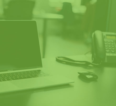 Image of laptop and phone on a desk